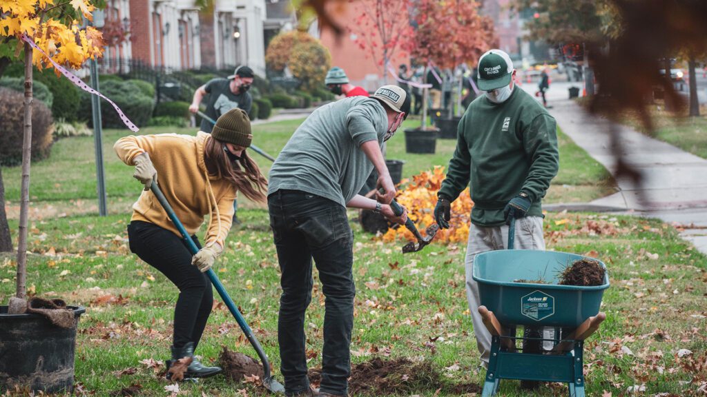 MadTree Brewing employees planting trees in Cincinnati Parks Laurel Park