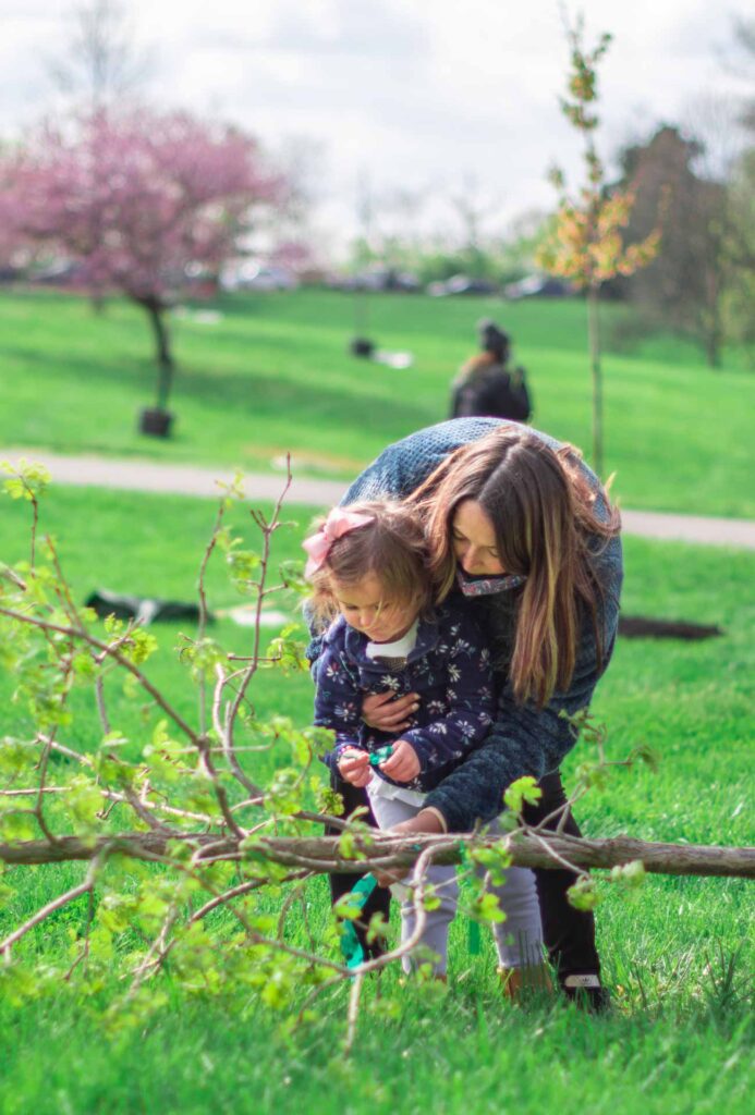 A mother and child planting a tree in Mt. Echo Park with LifeCenter