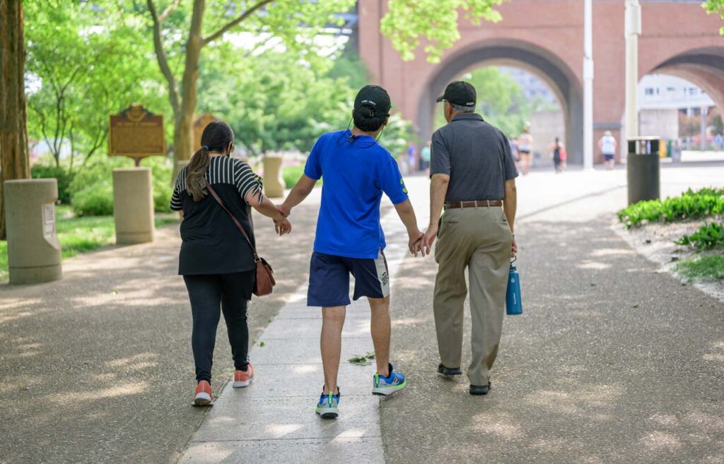 A family walks through Cincinnati Parks in the be.well Move Program