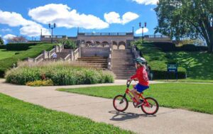 A boy riding his bike in Ault Park in celebration of the CROWN Cincinnati trail