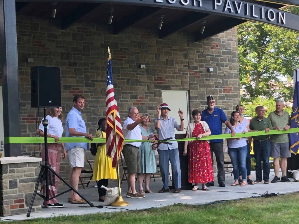 A group cutting the ribbon at the Kyle Plush Pavilion in Stanbery Park.