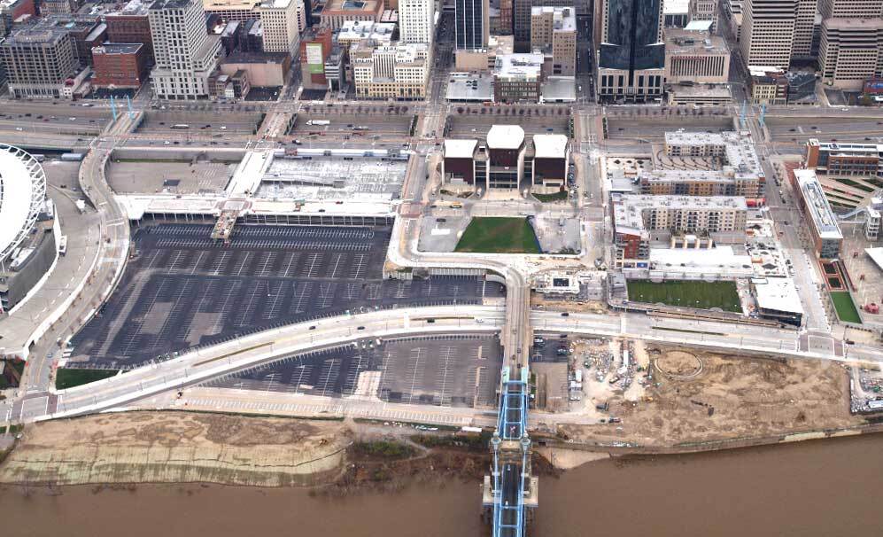 Gravel lot and parking lot before Smale Riverfront Park was built