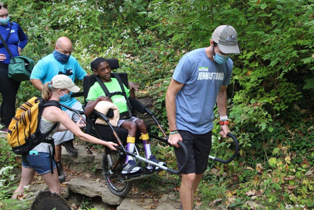 Child in the be.well Adaptive Hiking program
