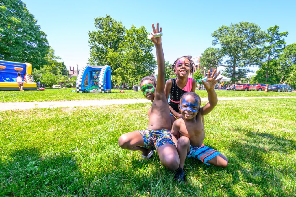 Children enjoying face painting at Free Family Fun Days in MLK Jr. Park.