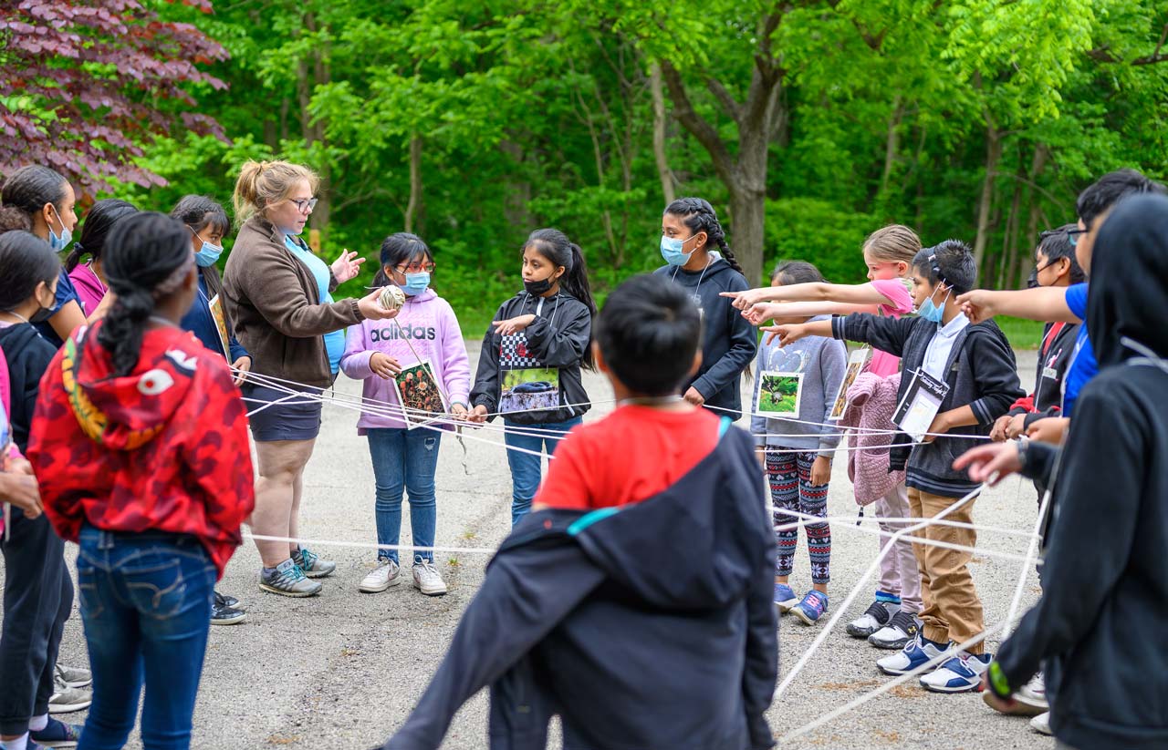 Cincinnati Parks' Explore Nature naturalist with children at a nature center
