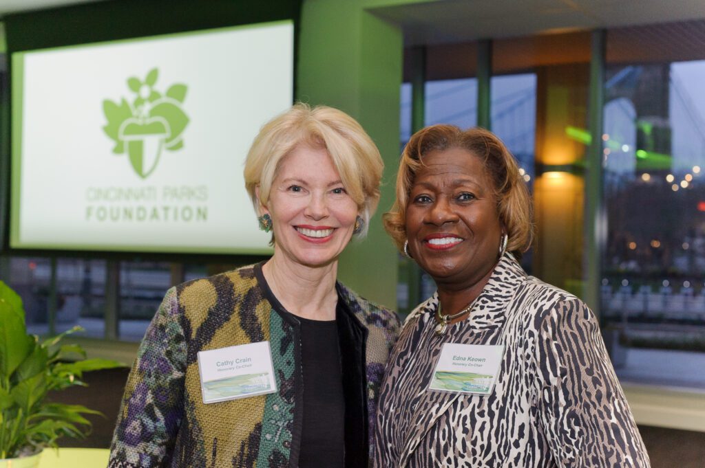 Cathy Crain is standing next to Edna Keown. They are both smiling at the camera