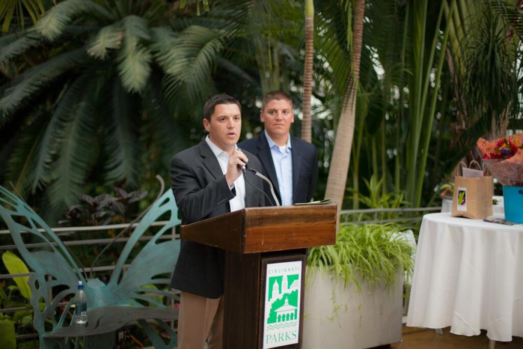 Kurt Scherzinger, President of ScherZinger Pest Control, speaks at the Krohn Fall Show Preview, accompanied by his brother Eric, Vice President of Procurement and Marketing. Photo by Nicholas Viltrakis.