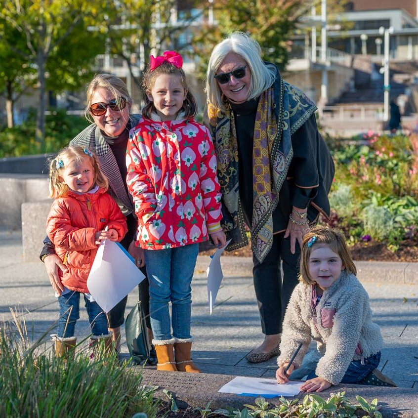 A family of women in the Smale Riverfront Park Women's Committee Garden