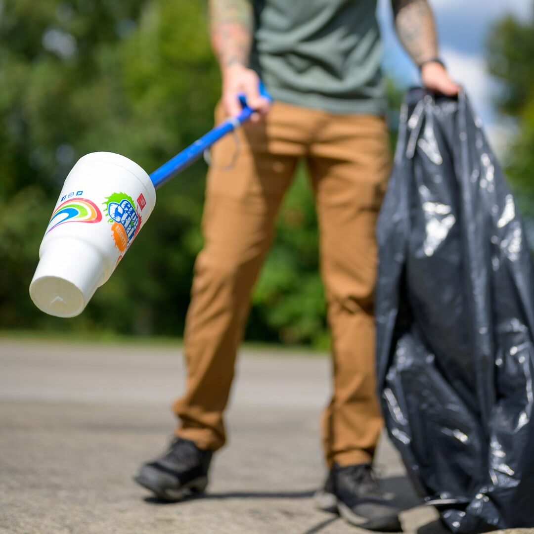 Person removing litter in Cincinnati Parks